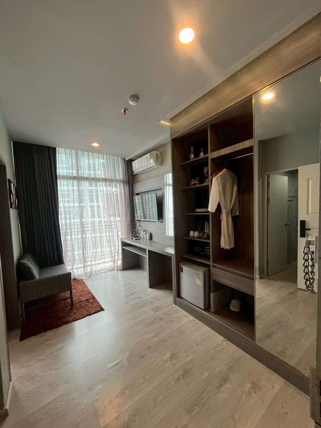 Furnished studio apartment with desk and wardrobe